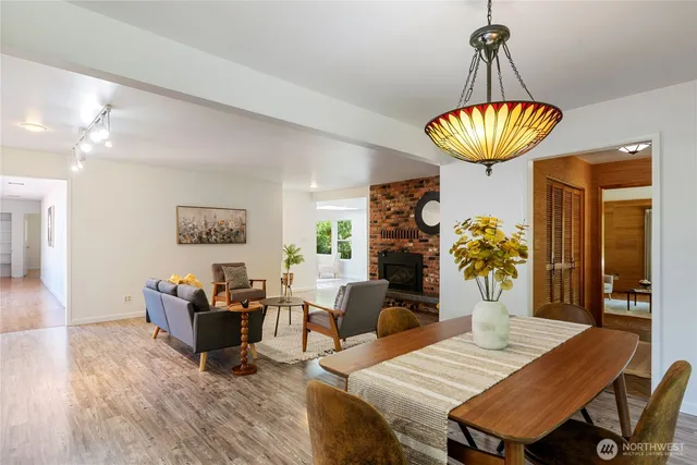 a view of a dining room with furniture and chandelier
