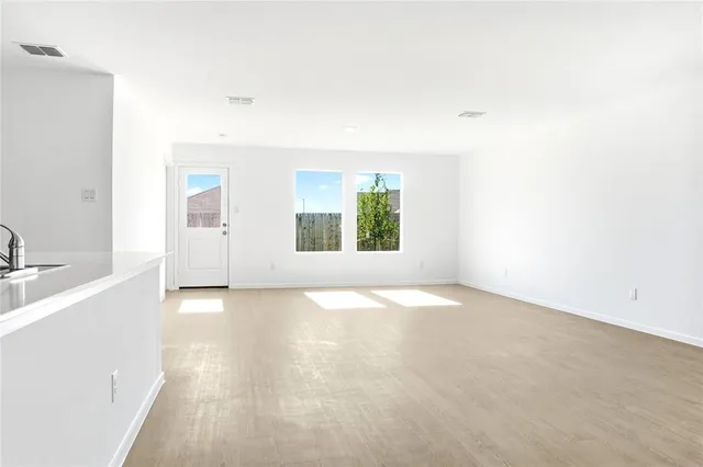 an empty room with windows