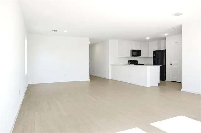 a view of a kitchen with a sink