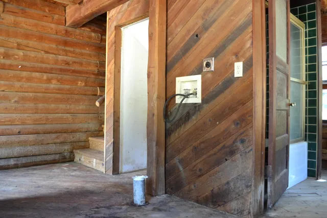a bathroom with a toilet sink and window