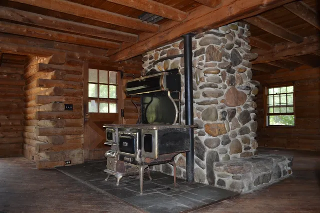 a room with chairs and window