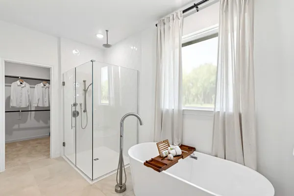 a bathroom with a sink a mirror and a shower