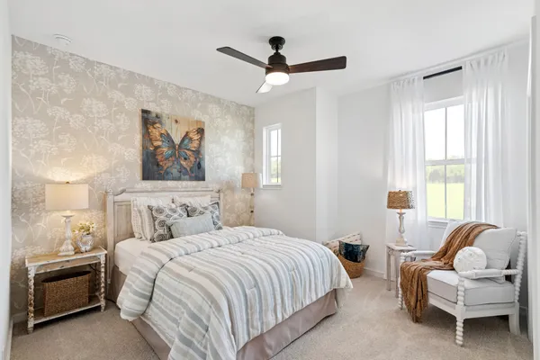 a bedroom with a bed and a couch