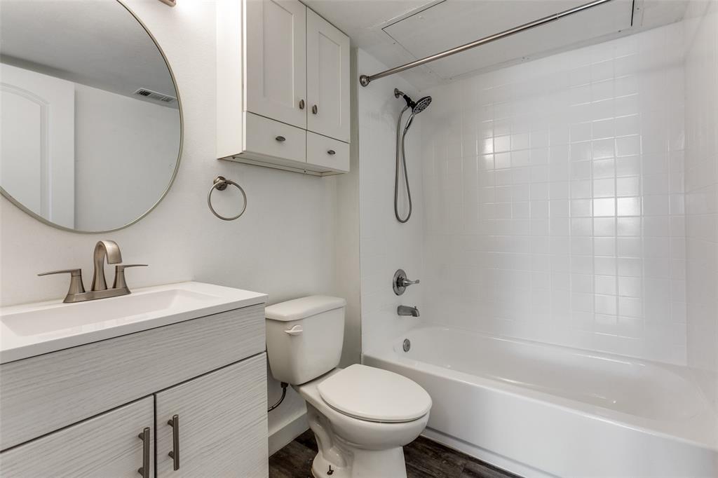 9829 Walnut Street, Unit 210 Dallas, TX 75243 - Photo 13 of 19 a bathroom with a sink toilet and a bathtub