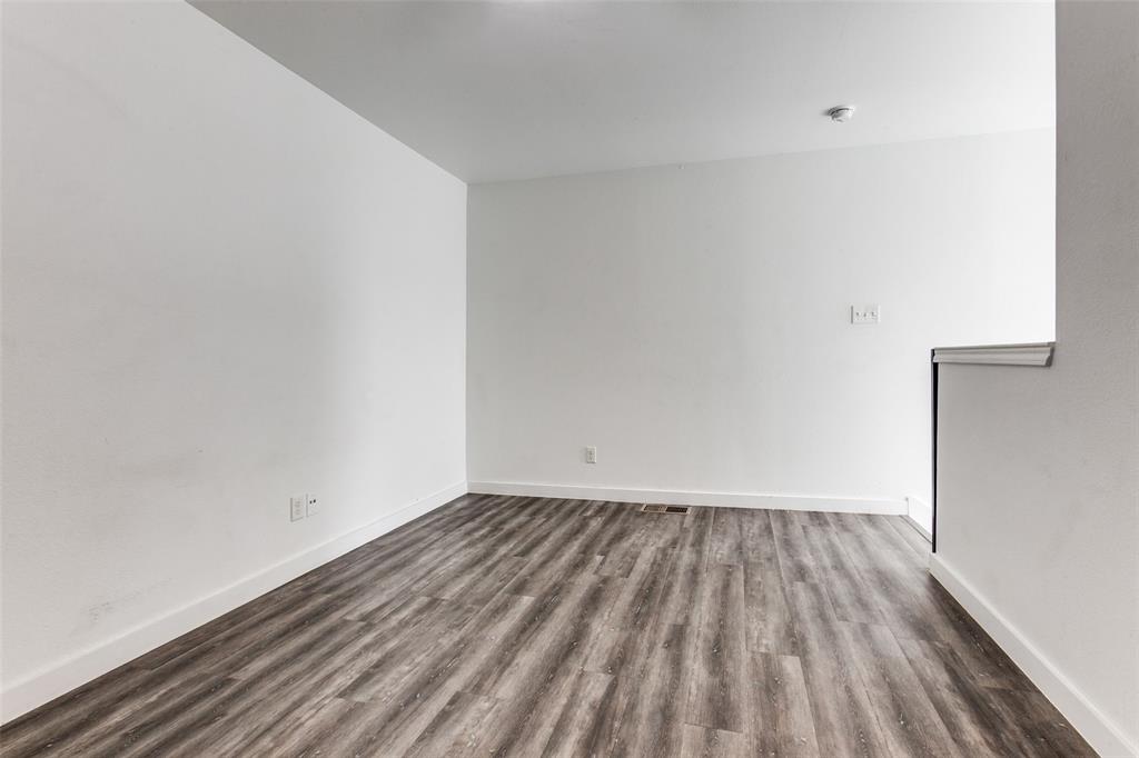 9829 Walnut Street, Unit 210 Dallas, TX 75243 - Photo 17 of 19 a view of room with wooden floor