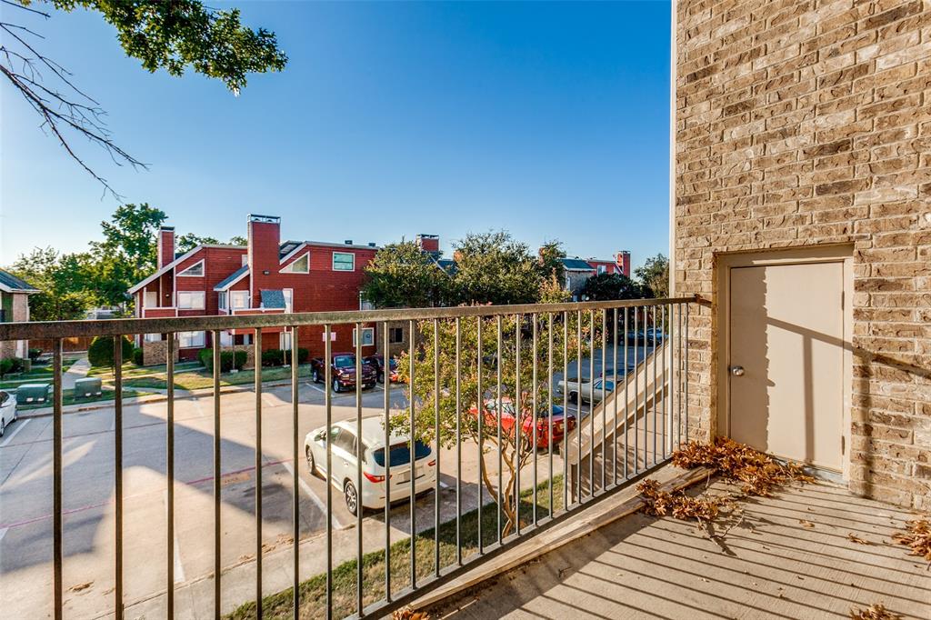9829 Walnut Street, Unit 210 Dallas, TX 75243 - Photo 19 of 19 a view of a balcony with wooden floor