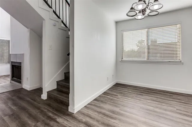 wooden floor in an empty room with a window and wooden floor