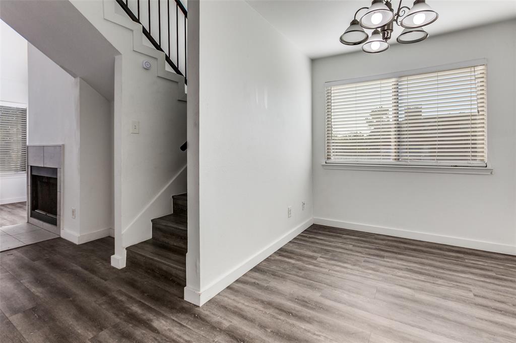 9829 Walnut Street, Unit 210 Dallas, TX 75243 - Photo 3 of 19 wooden floor in an empty room with a window and wooden floor