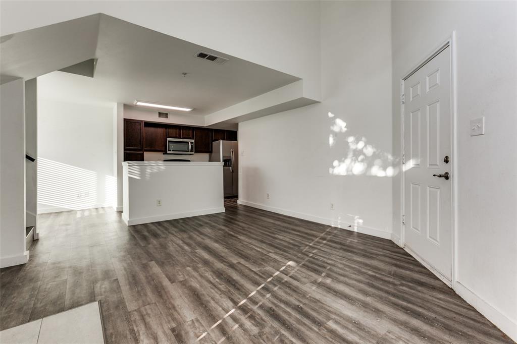 9829 Walnut Street, Unit 210 Dallas, TX 75243 - Photo 5 of 19 a view of a livingroom with a kitchen