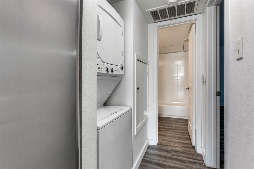 9829 Walnut Street, Unit 210 Dallas, TX 75243 - Photo 10 of 19 a view of a hallway with wooden floor and entryway