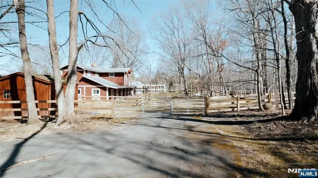 a view of a yard with snow on the road