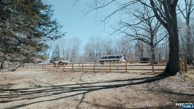 an aerial view of house with yard and mountain view