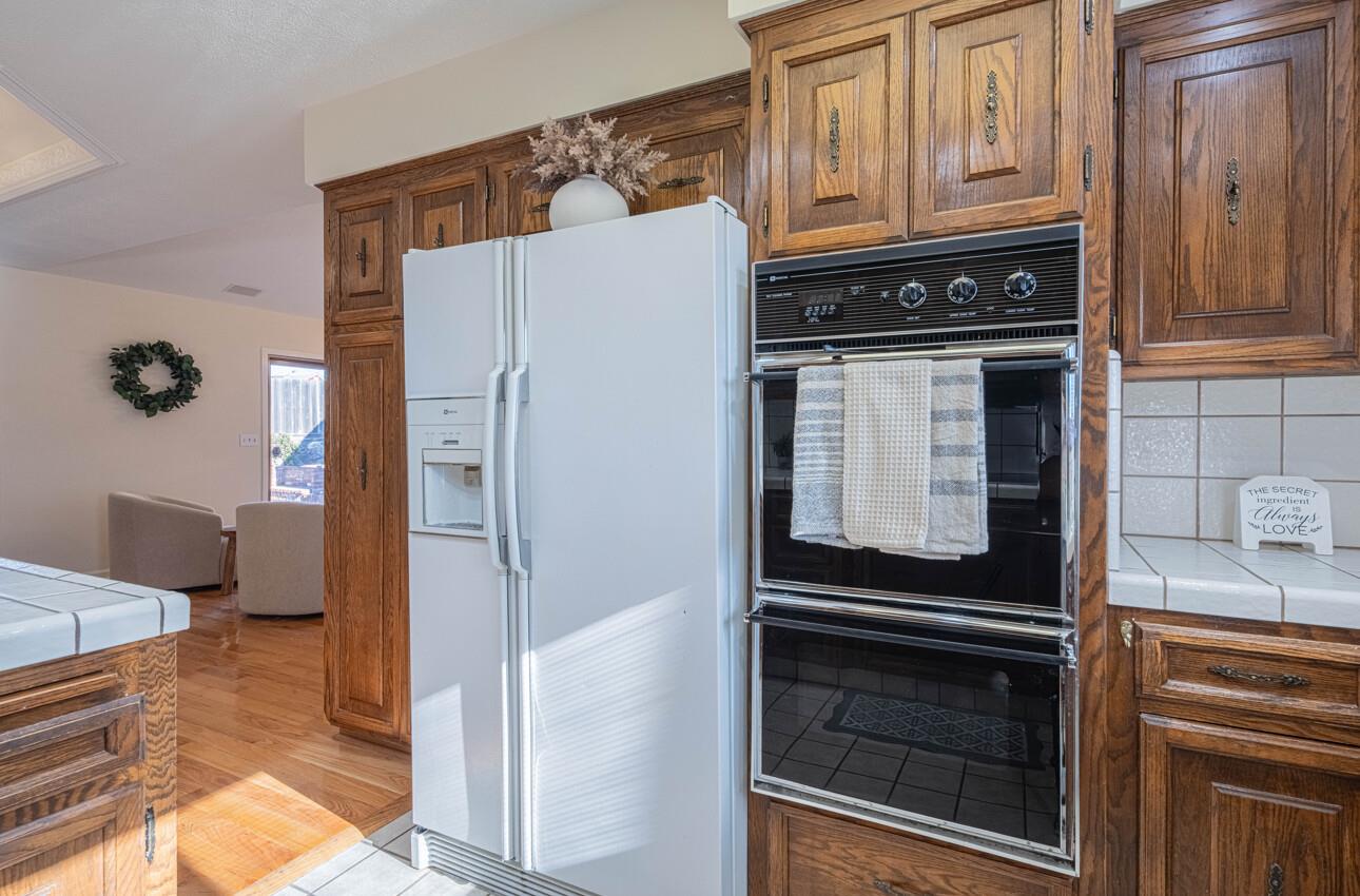 1527 Atherton Way Salinas, CA 93906 - Photo 12 of 64 a kitchen with stainless steel appliances granite countertop a refrigerator and a stove