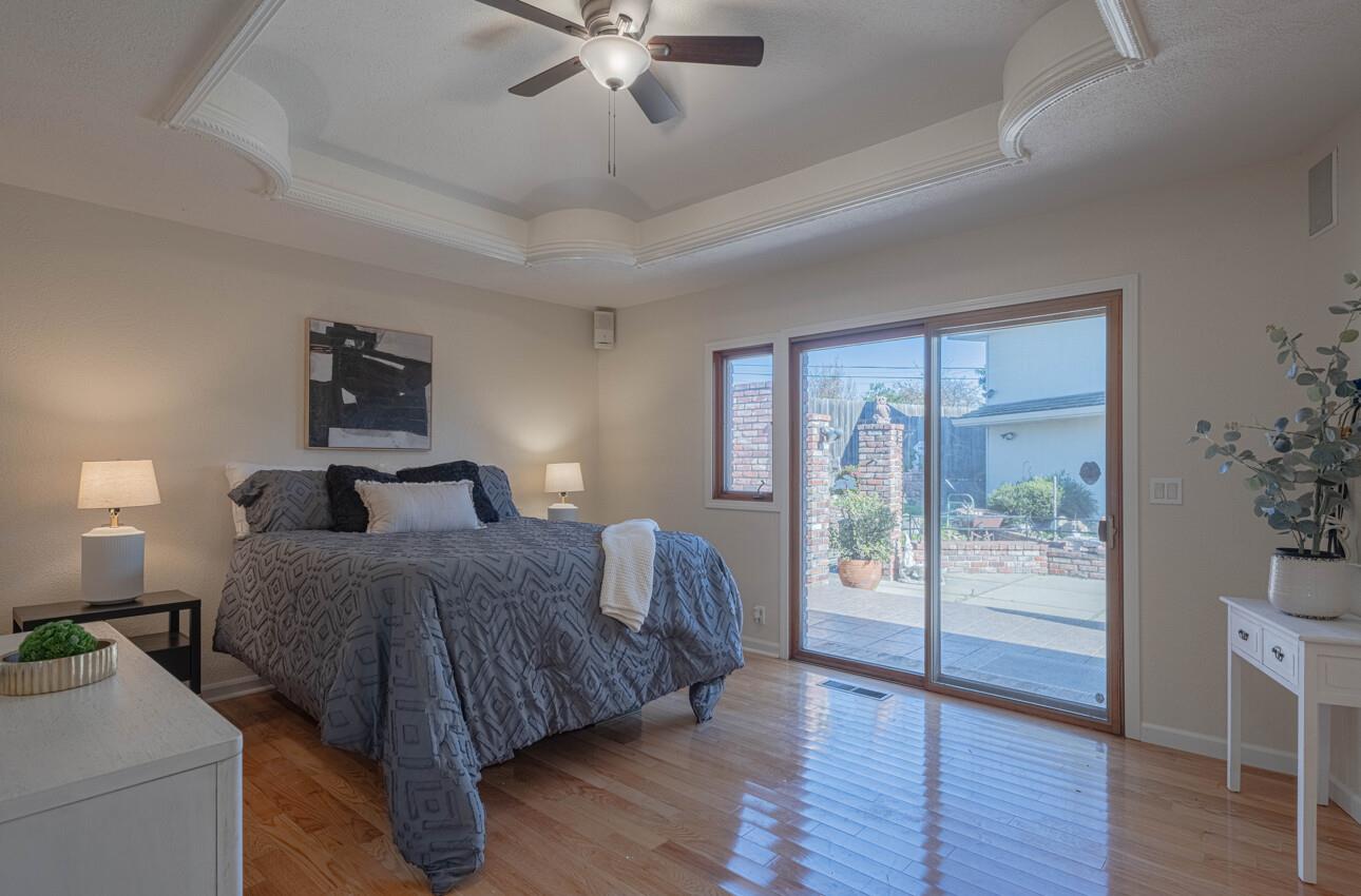 1527 Atherton Way Salinas, CA 93906 - Photo 26 of 64 a bedroom with a bed and wooden floor