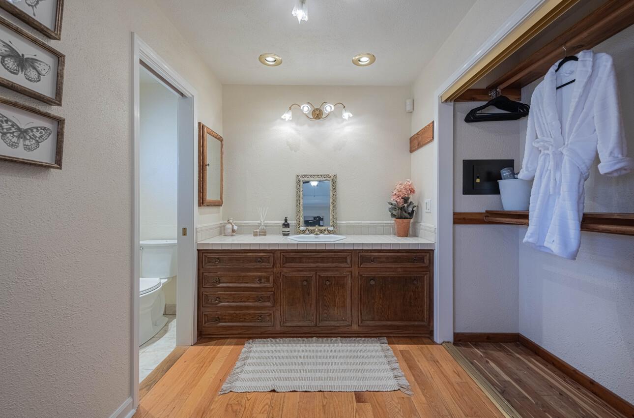 1527 Atherton Way Salinas, CA 93906 - Photo 31 of 64 a spacious bathroom with a sink and a mirror
