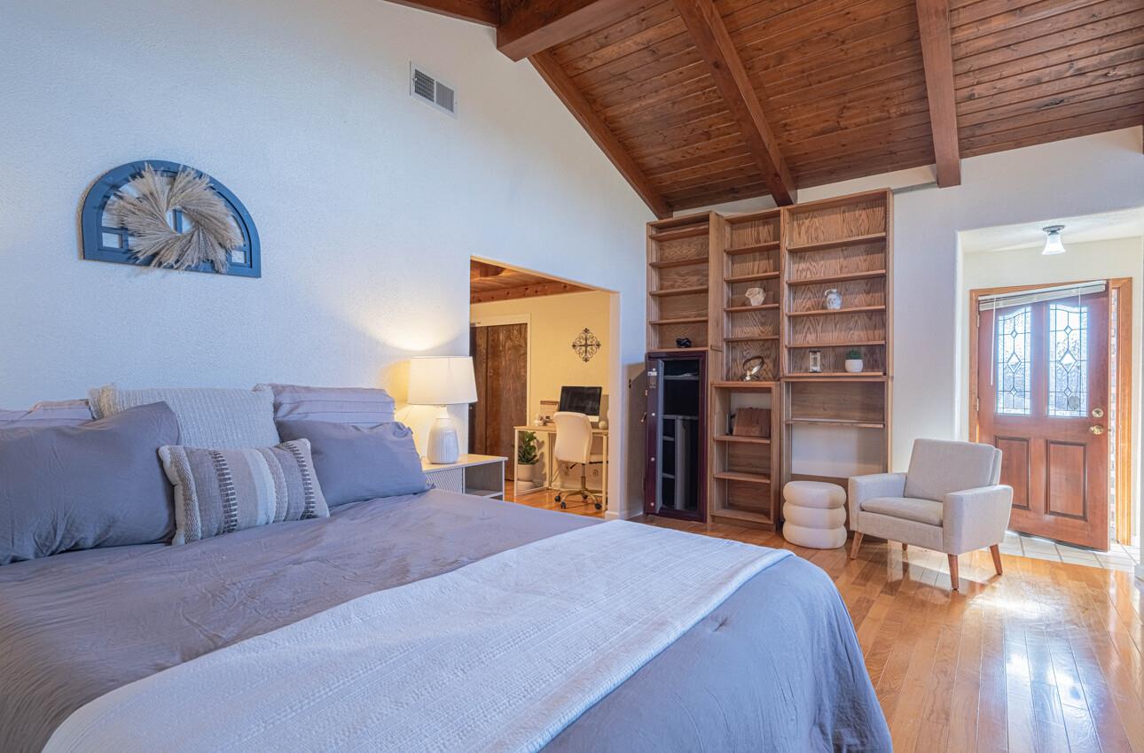 1527 Atherton Way Salinas, CA 93906 - Photo 45 of 64 a spacious bedroom with a bed and a chair