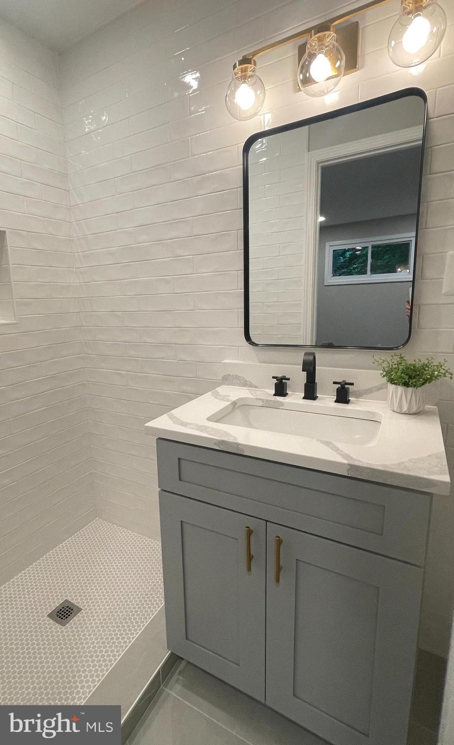 3610 Cornell Road Fairfax, VA 22030 - Photo 10 of 18 Primary bath with new tile, vanity & lighting