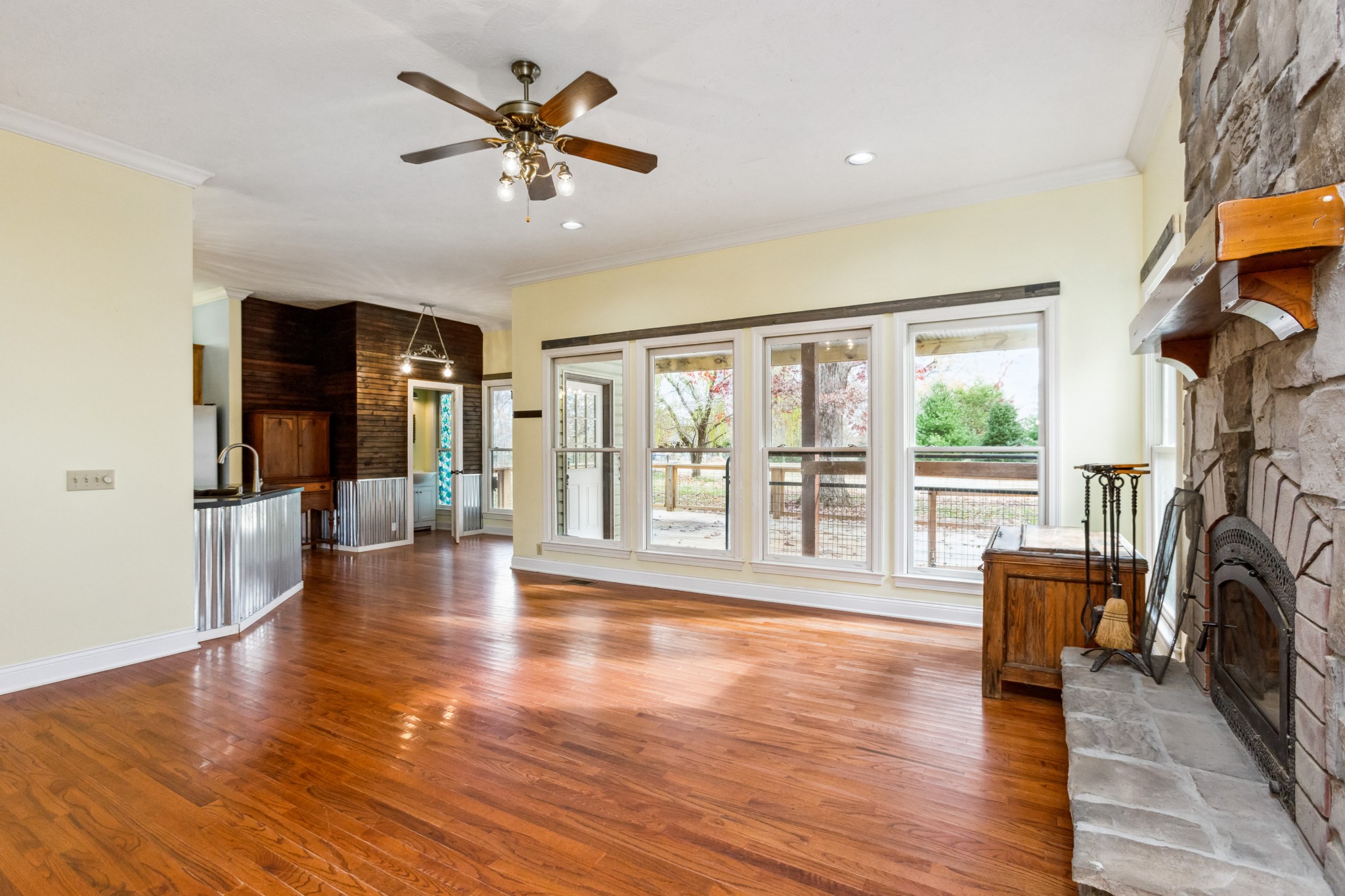 6194 South Lamont Road Springfield, TN 37172 - Photo 24 of 62 a living room with fireplace furniture and a floor to ceiling window