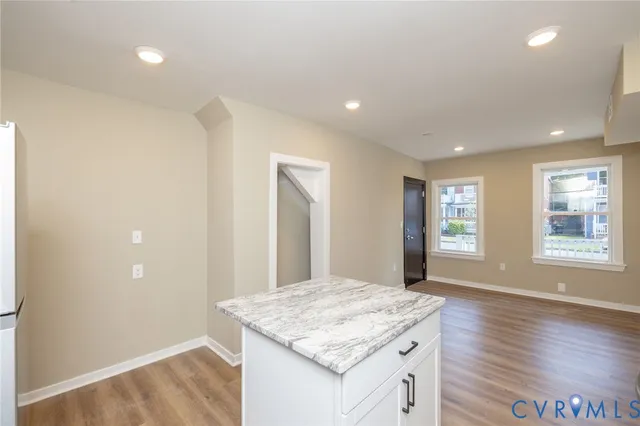 a kitchen with a sink and chandelier