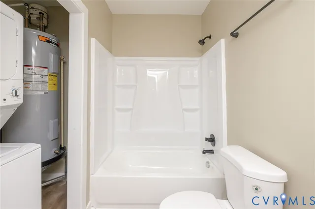 a bathroom with a toilet and a bathtub