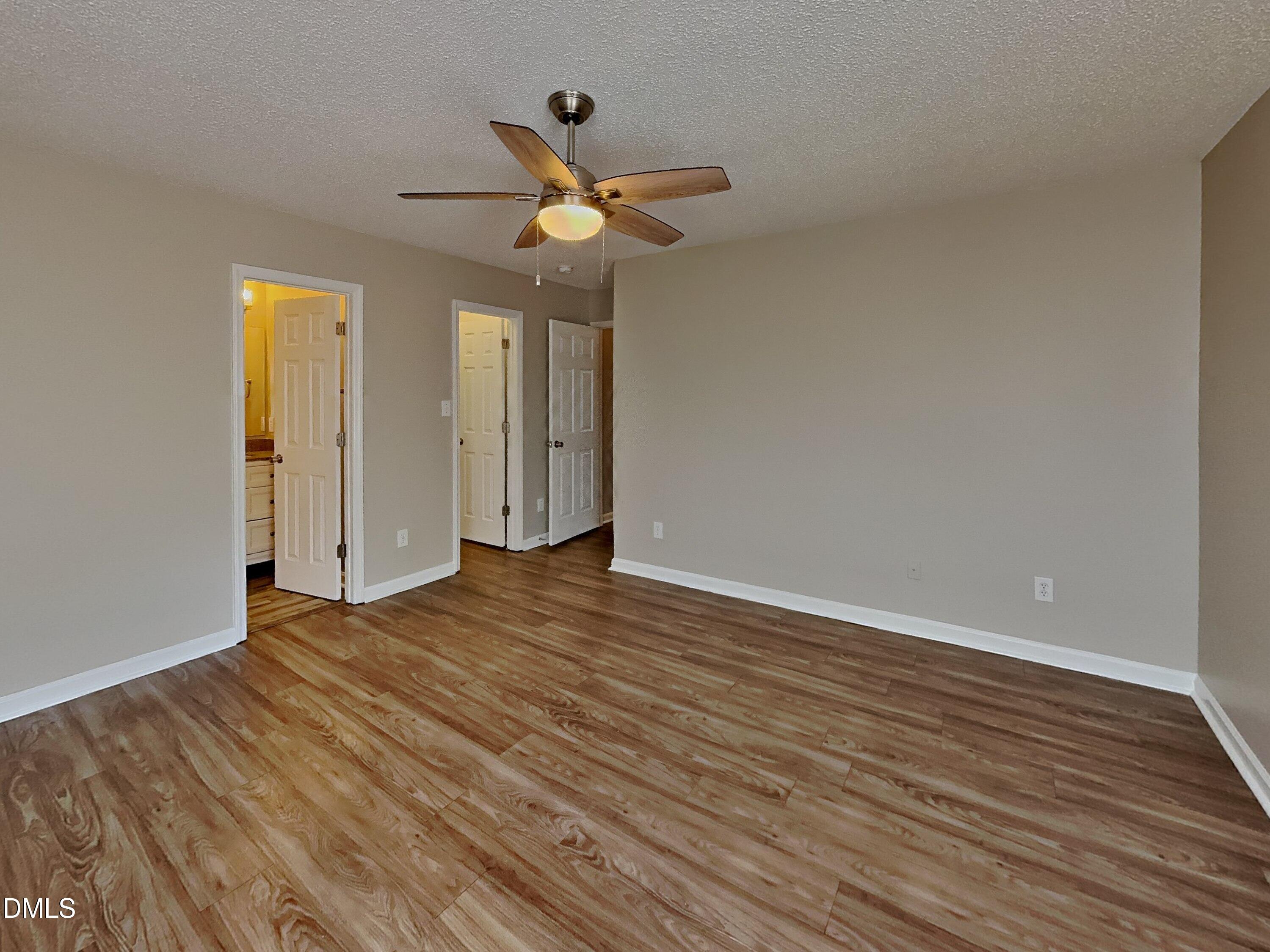5516 Wilhagan Court Raleigh, NC 27616 - Photo 7 of 16 a view of empty room with wooden floor