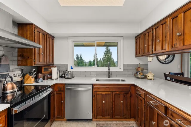 a kitchen with a sink and cabinets