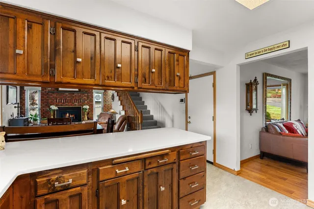 a living room with furniture and a dining table