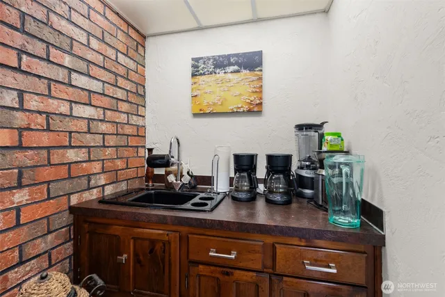 a bathroom with a sink toilet and mirror