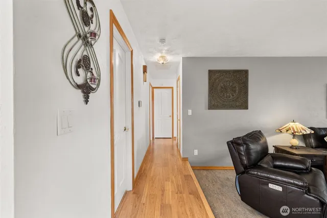 a view of a chair and table in backyard of the house