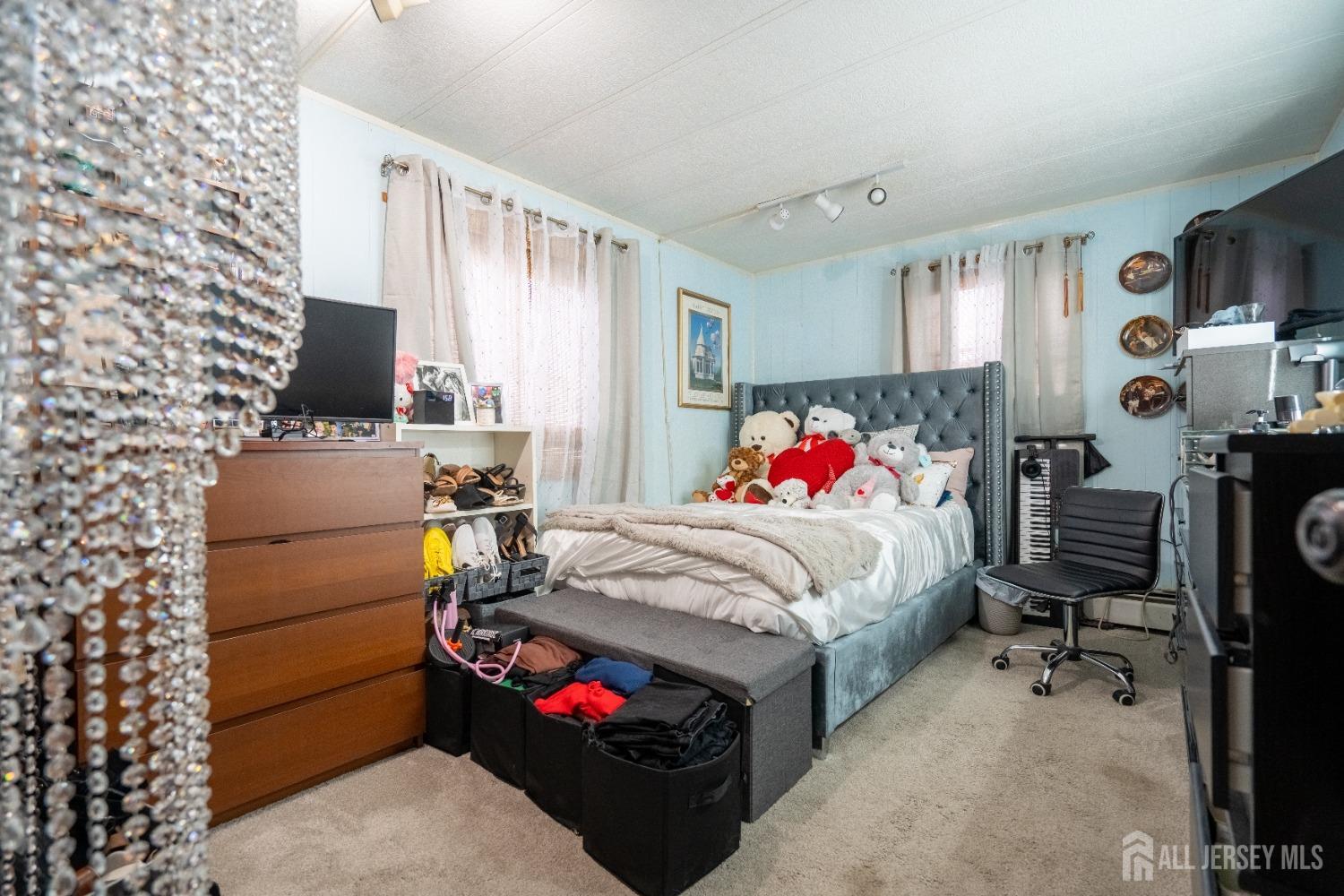 15 Dickens Road North Brunswick, NJ 08902 - Photo 25 of 38 a bed room with a bed and a chair