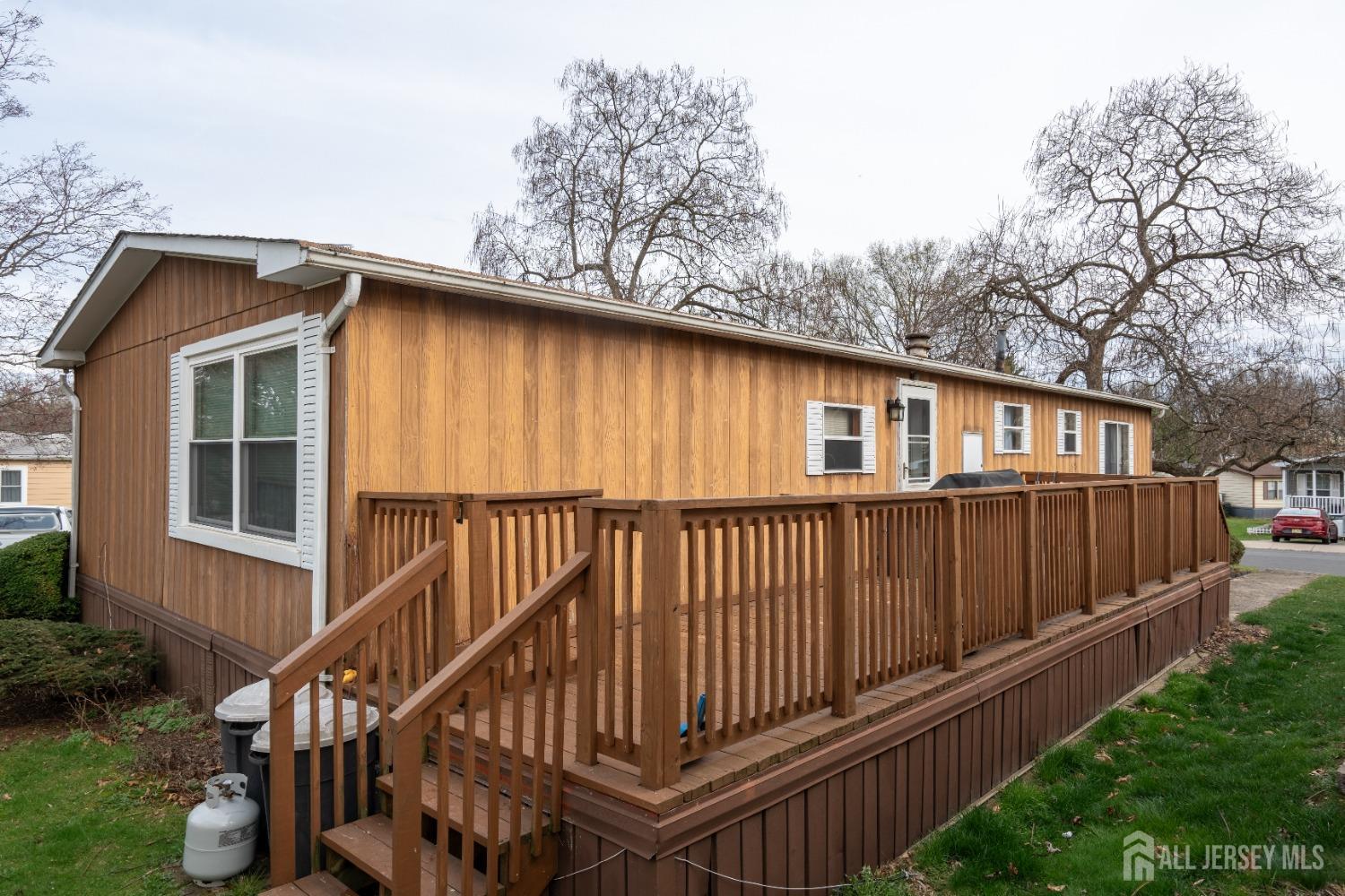 15 Dickens Road North Brunswick, NJ 08902 - Photo 35 of 38 a front view of a house with wooden deck