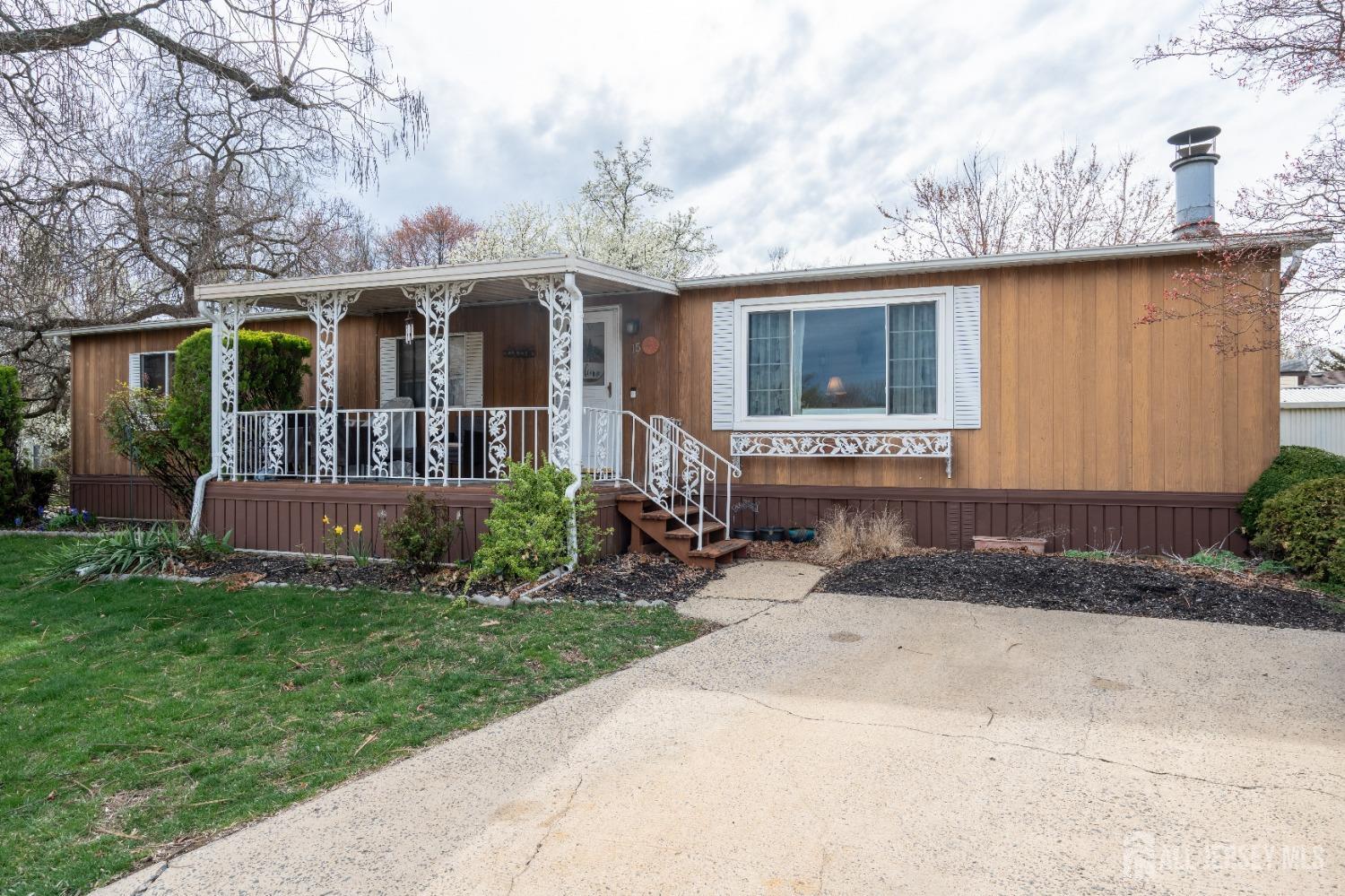 15 Dickens Road North Brunswick, NJ 08902 - Photo 5 of 38 a view of a house with a yard and sitting area