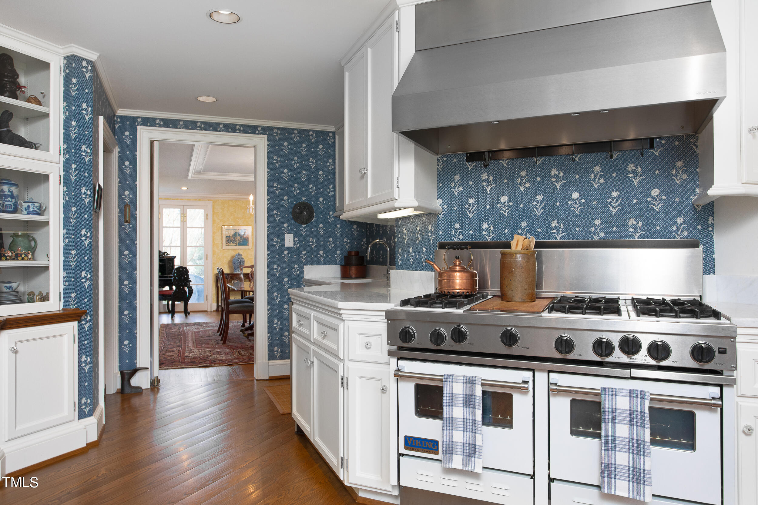 3940 Dover Road Durham, NC 27707 - Photo 34 of 72 a kitchen with stainless steel appliances granite countertop a stove and a refrigerator