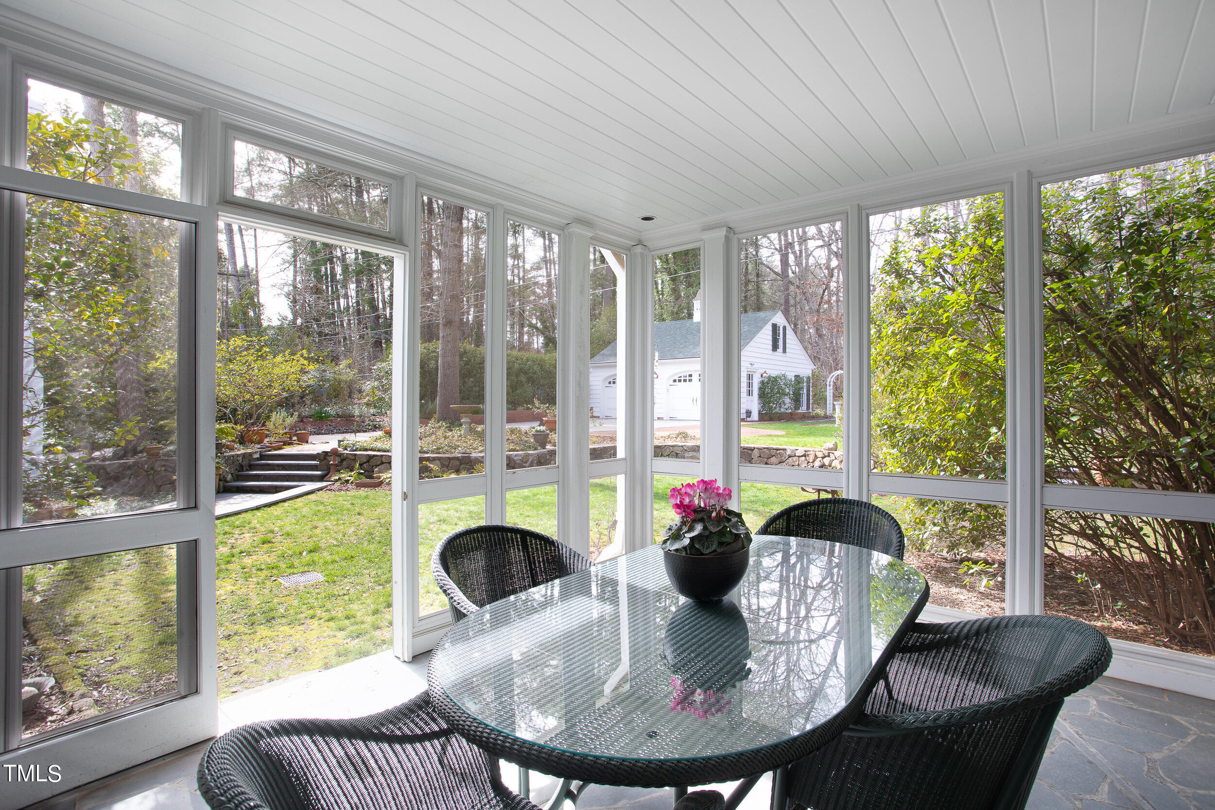 3940 Dover Road Durham, NC 27707 - Photo 39 of 72 a dining room with furniture water view and a floor to ceiling window