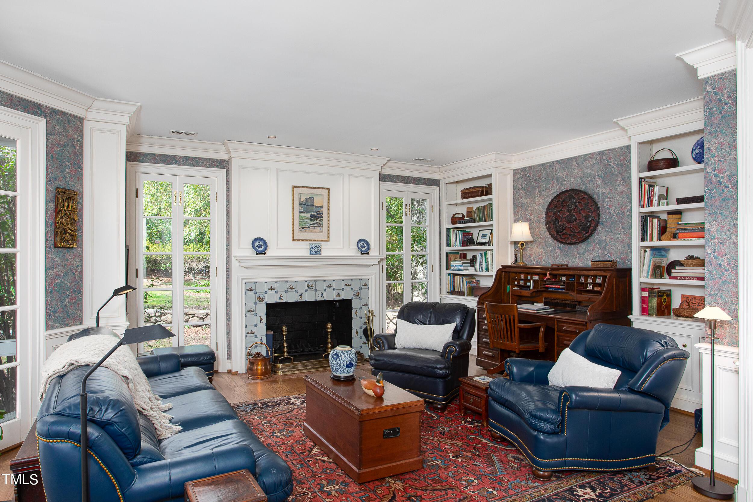 3940 Dover Road Durham, NC 27707 - Photo 44 of 72 a living room with furniture a fireplace and a large window