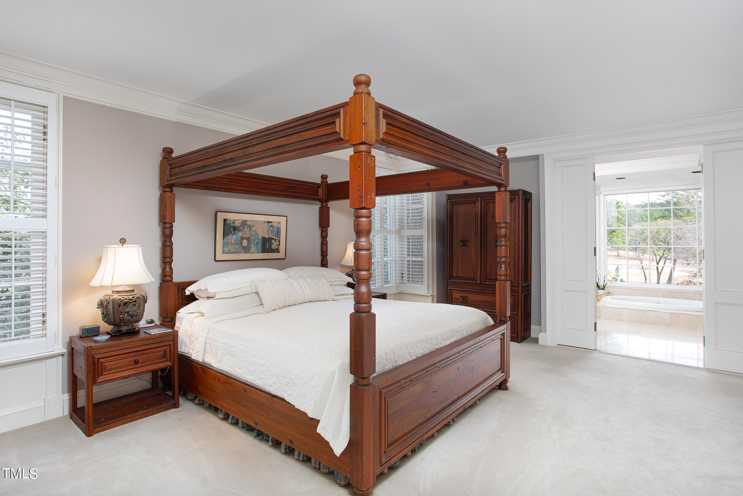3940 Dover Road Durham, NC 27707 - Photo 45 of 72 a bed sitting in a bedroom next to a window