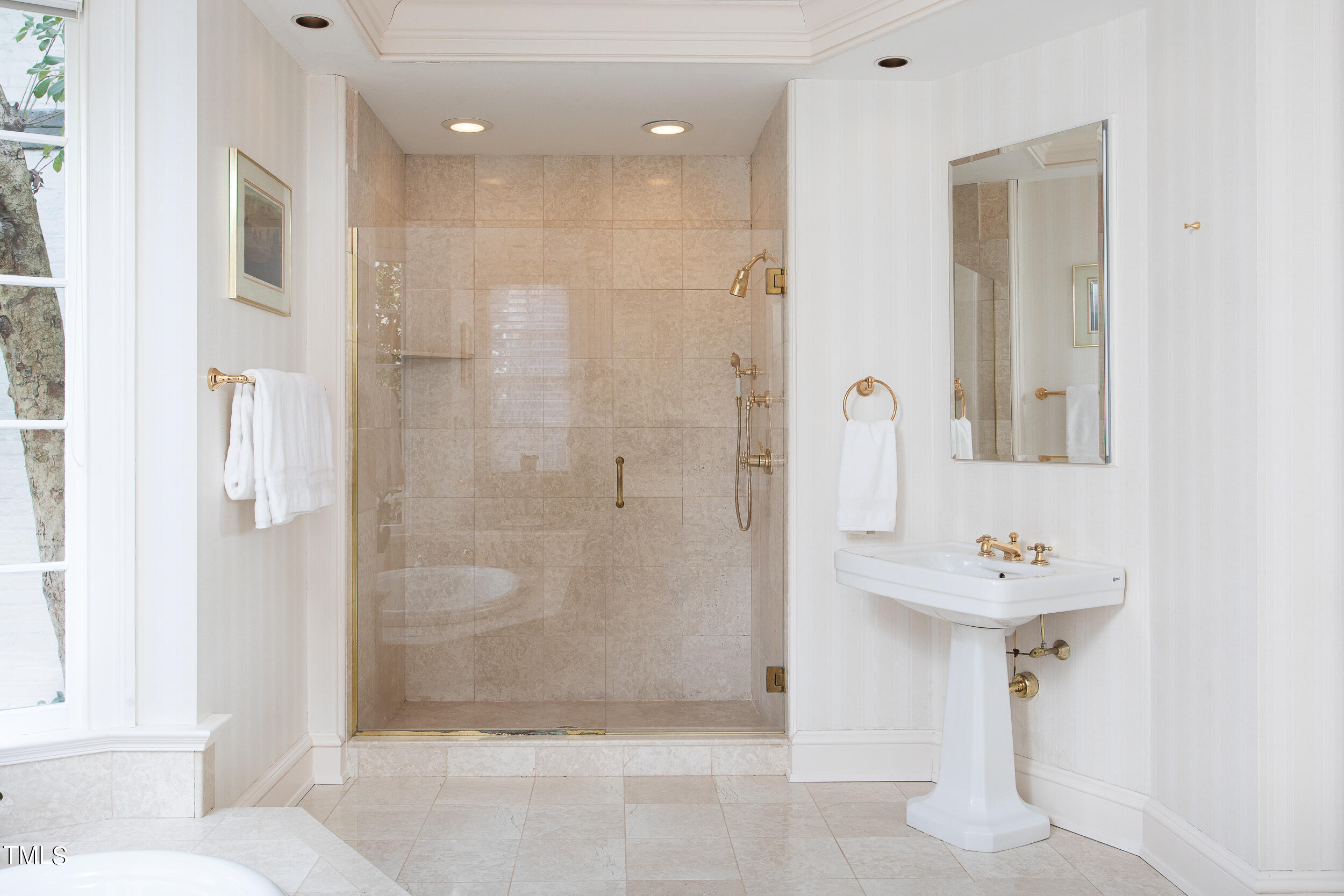 3940 Dover Road Durham, NC 27707 - Photo 46 of 72 a bathroom with a shower sink and a mirror