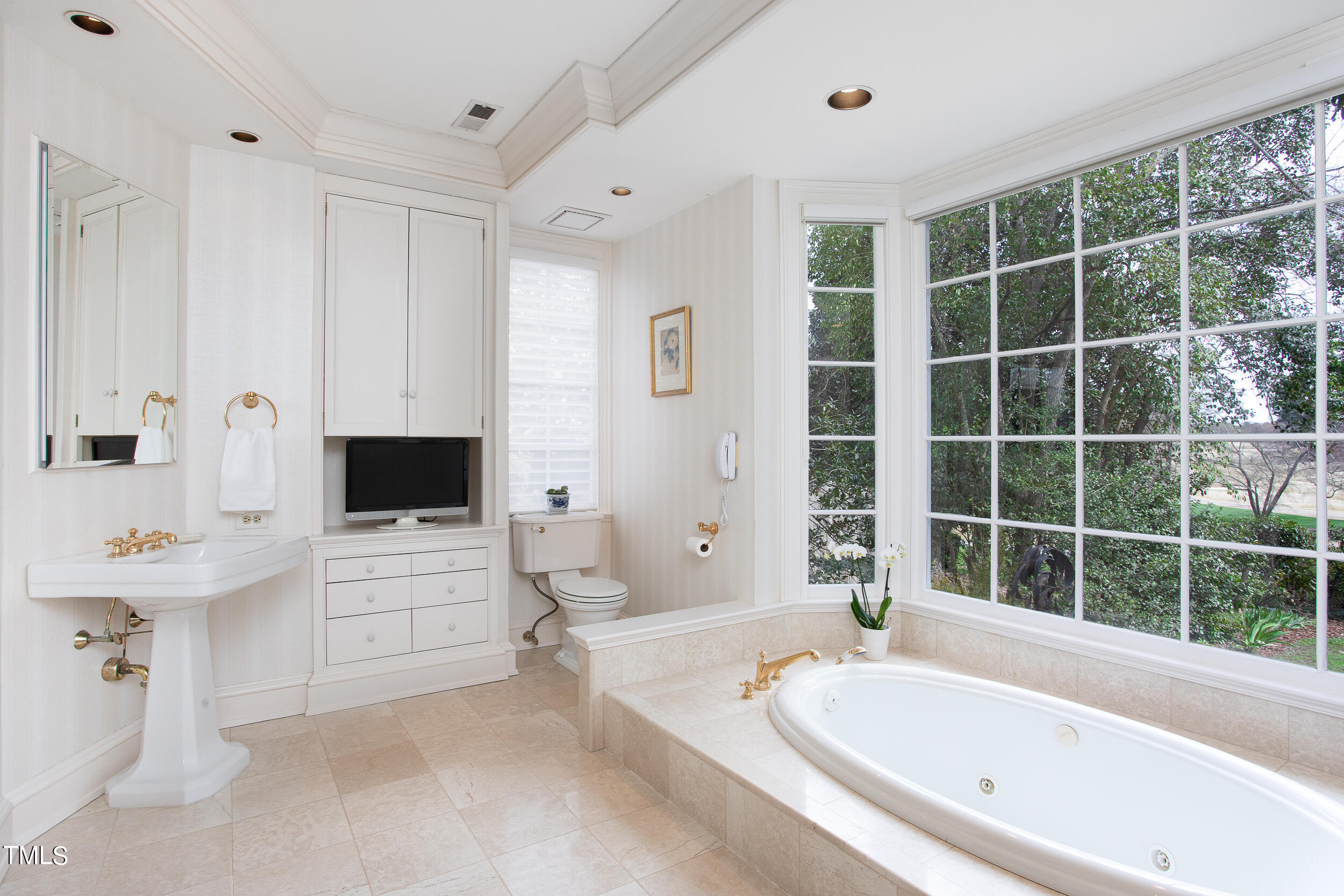 3940 Dover Road Durham, NC 27707 - Photo 47 of 72 a bathroom with a tub sink a mirror and a bathtub