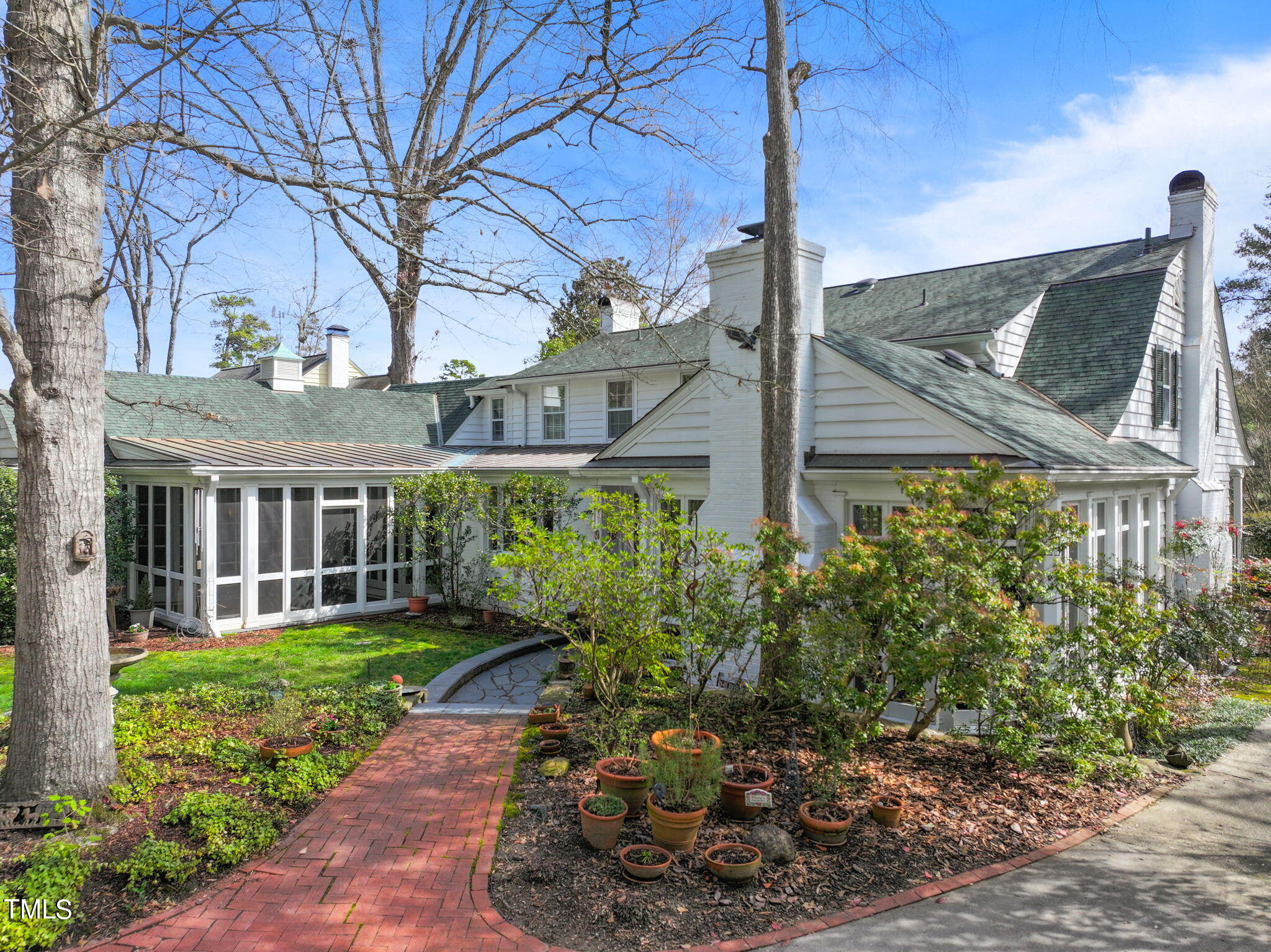 3940 Dover Road Durham, NC 27707 - Photo 59 of 72 a view of a house with a yard and potted plants
