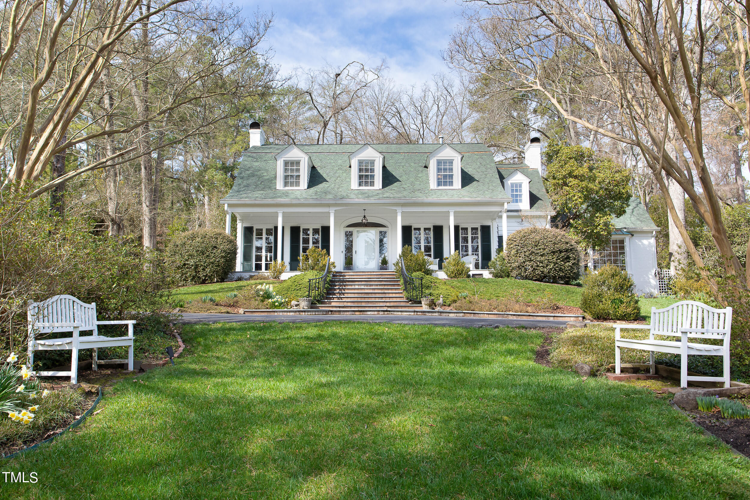 3940 Dover Road Durham, NC 27707 - Photo 64 of 72 a front view of a house with a garden and trees
