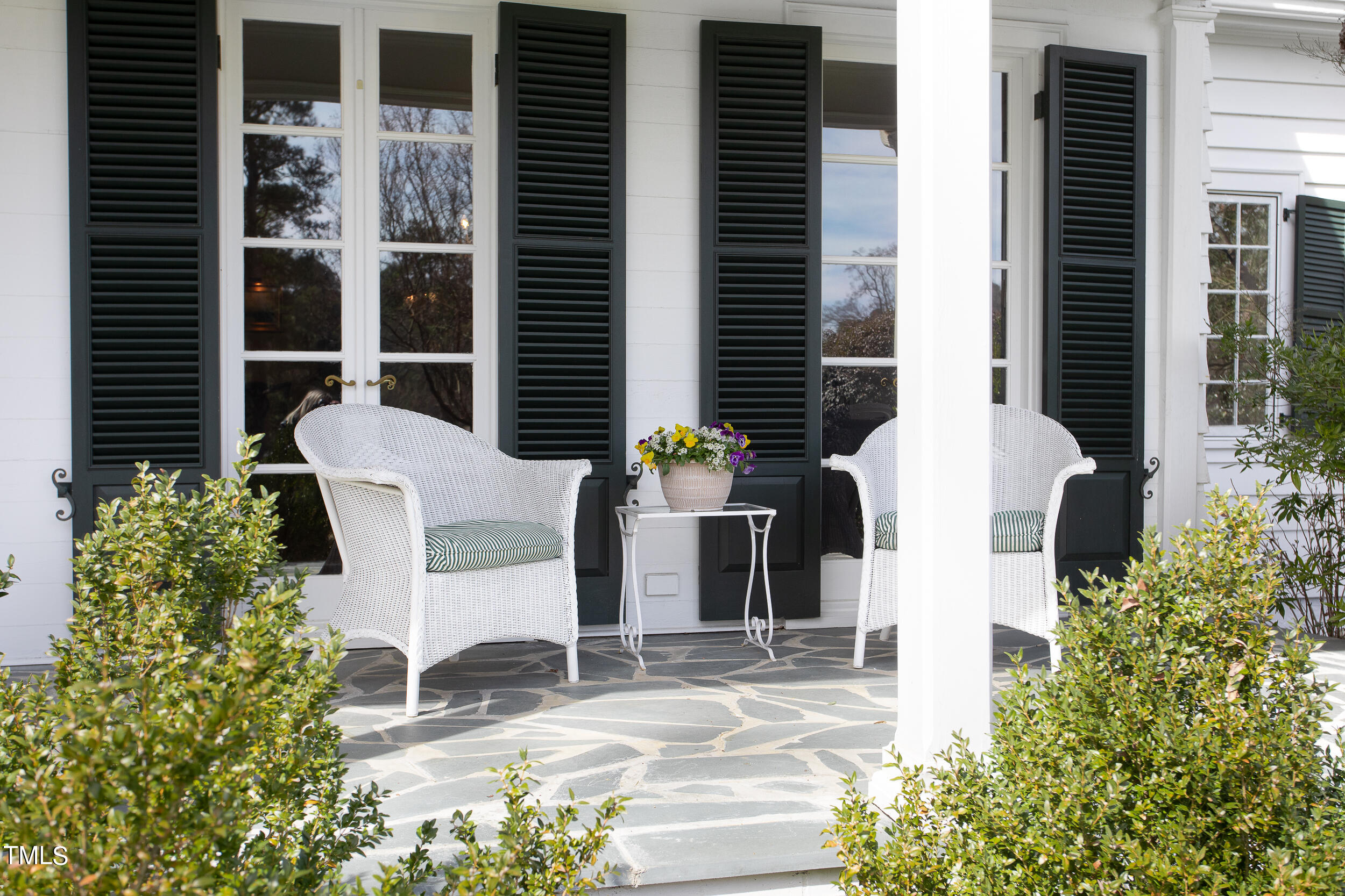 3940 Dover Road Durham, NC 27707 - Photo 7 of 72 a view of a patio with plants and table and chairs and potted plants