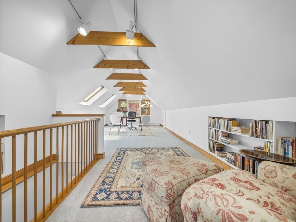 33 Longmeadow Road Wellesley, MA 02482 - Photo 11 of 15 a bedroom with a bed and a book shelf