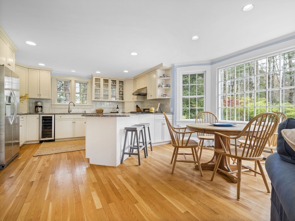 33 Longmeadow Road Wellesley, MA 02482 - Photo 8 of 15 a dining hall with stainless steel appliances granite countertop a stove and a wooden floors