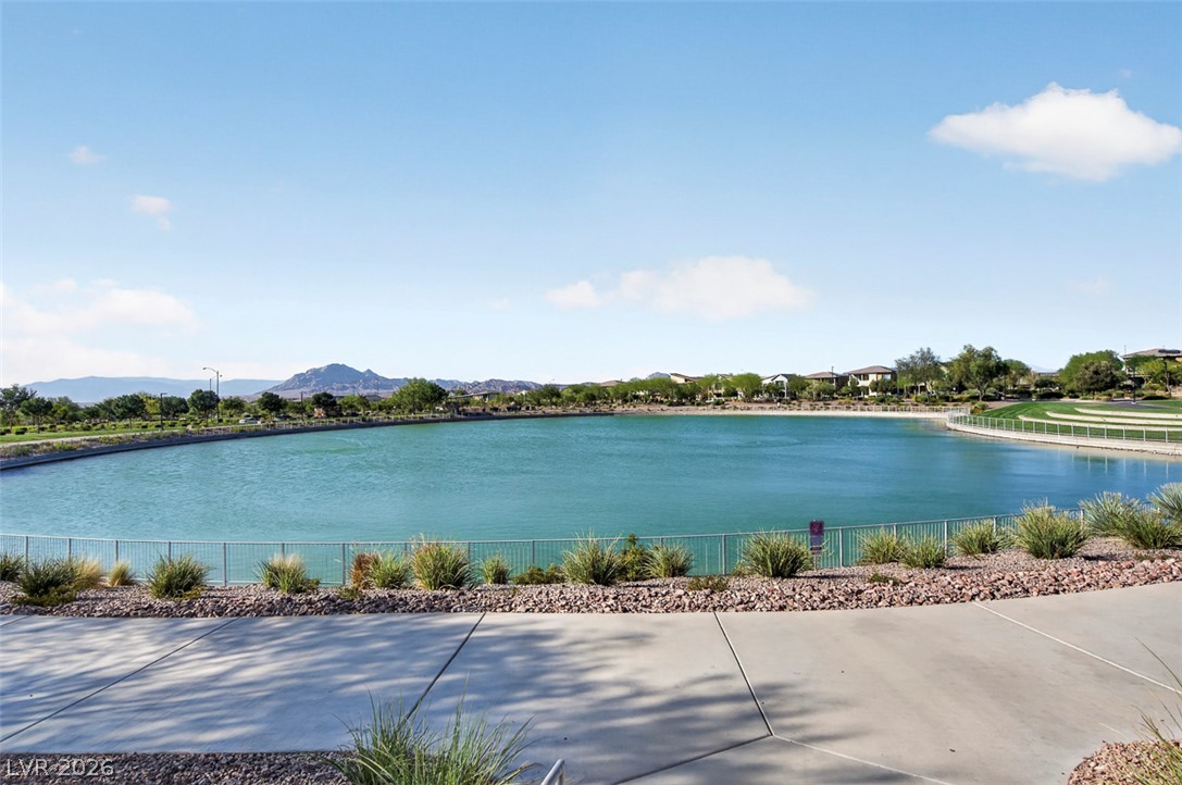 1100 East Sunset Road Henderson, NV 89011 - Photo 53 of 58 Enjoy tranquil lake views with distant mountains and community residences under a wide sky.
