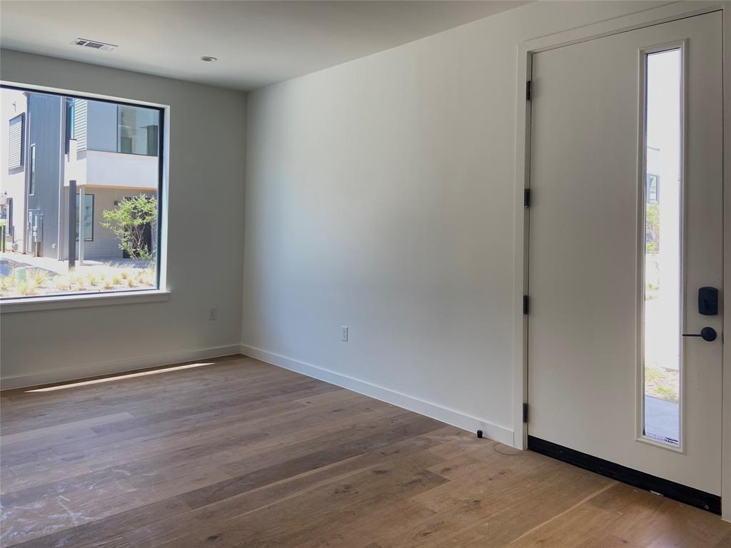1111 Raiford Road, Unit 128 Carrollton, TX 75007 - Photo 16 of 18 Entry level has 2nd living room, elevator, an oversized 2 car garage, 2 bedrooms, and full bath. Perfect for multi-generational living. (construction photos - professional photos upon completion)