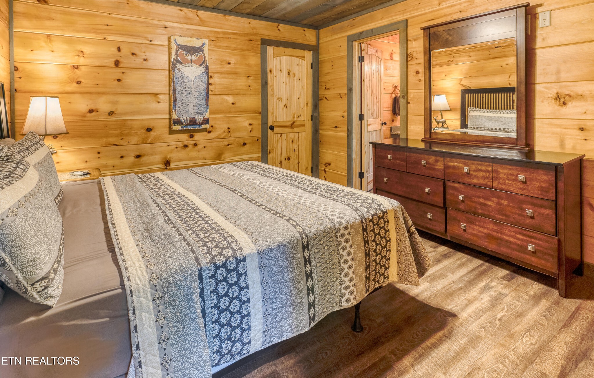 809 Pinecrest Way Sevierville, TN 37862 - Photo 17 of 60 a spacious bedroom with a bed and a large window