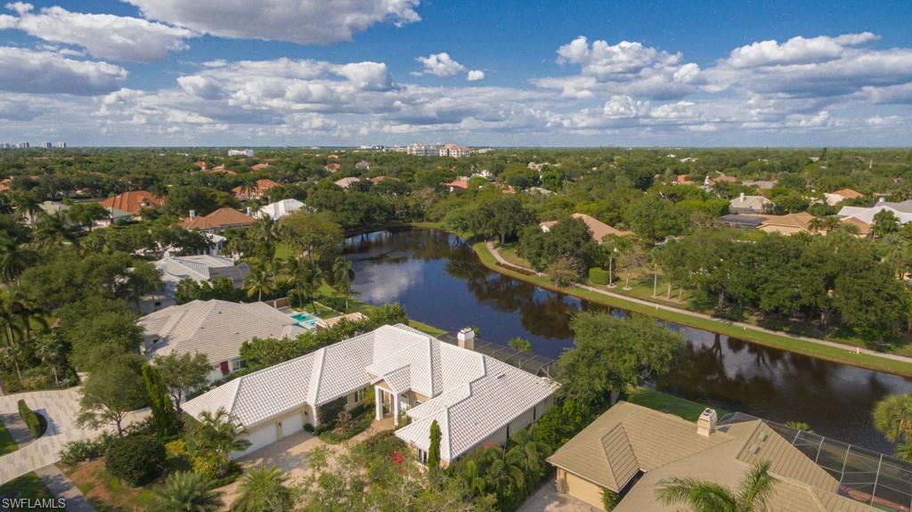 6974 Green Tree Drive Naples, FL 34108 - Photo 2 of 32 an aerial view of residential houses with outdoor space
