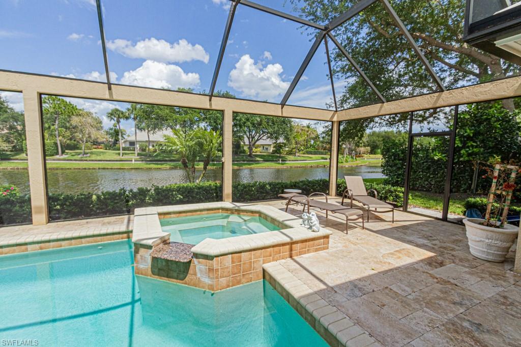 6974 Green Tree Drive Naples, FL 34108 - Photo 26 of 32 a view of a patio with a table chairs and a backyard