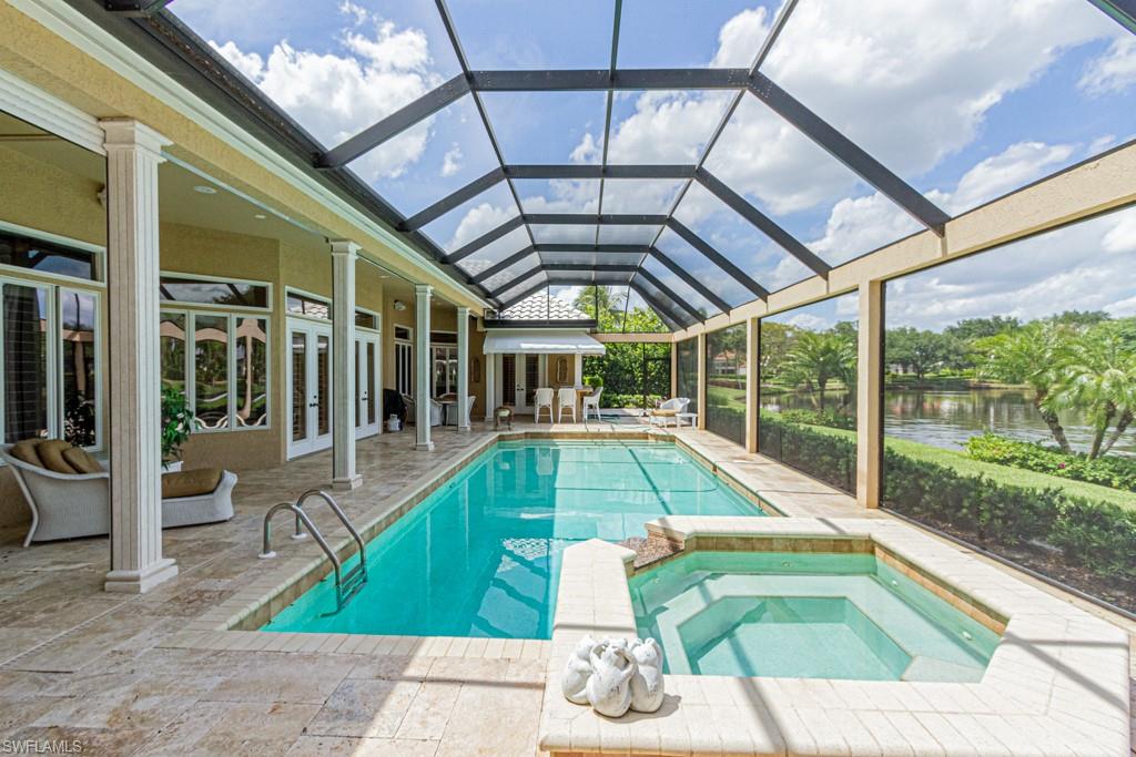 6974 Green Tree Drive Naples, FL 34108 - Photo 28 of 32 a swimming pool with a outdoor seating and yard