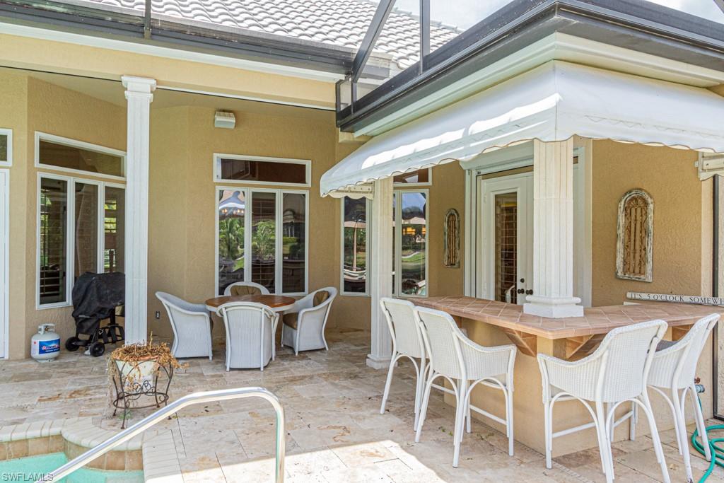 6974 Green Tree Drive Naples, FL 34108 - Photo 29 of 32 a view of a dining room with furniture window and outside view
